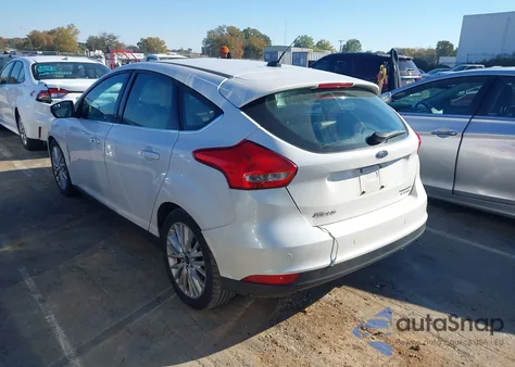2015 Ford Focus Titanium z USA, uszkodzony, nr VIN 1FADP3N25FL216058